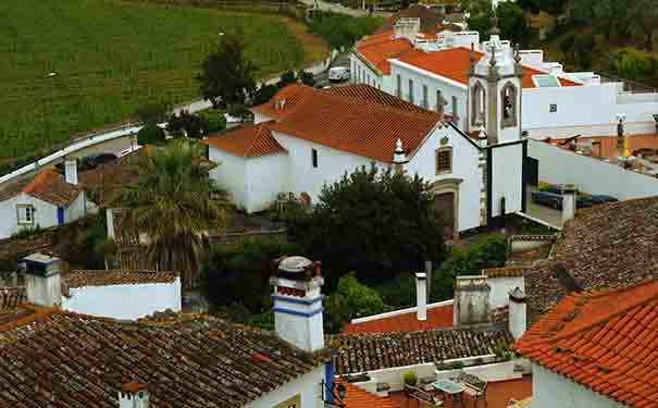 View over the rooftops and walls of Óbidos